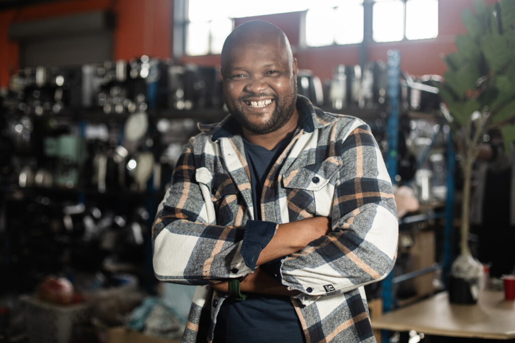 Nkumbulo Magqabi TCB Repair entrepreneur repairing and selling appliances in Langa
